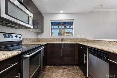 This two-story, townhouse-style condominium offers two primary - photo 14