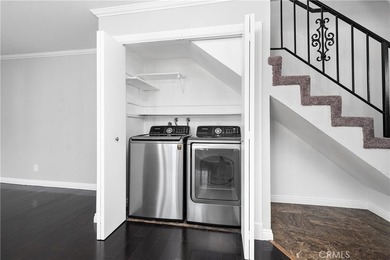 This two-story, townhouse-style condominium offers two primary - photo 16