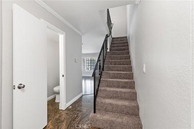 This two-story, townhouse-style condominium offers two primary - photo 18