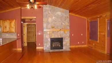 Discover the charm of this stunning log cabin home, which offers - photo 9