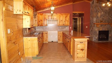 Discover the charm of this stunning log cabin home, which offers - photo 10
