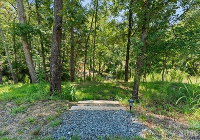 Quietly tucked along the wooded shoreline of Lake Wylie, this - photo 43