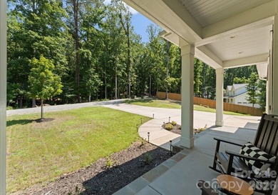 Quietly tucked along the wooded shoreline of Lake Wylie, this - photo 46