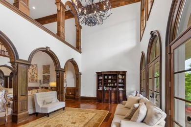 Tucked inside the gated Valley Falls Estates, this custom home