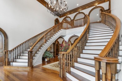 Tucked inside the gated Valley Falls Estates, this custom home
