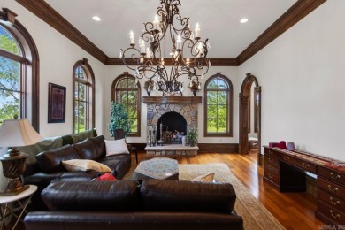 Tucked inside the gated Valley Falls Estates, this custom home