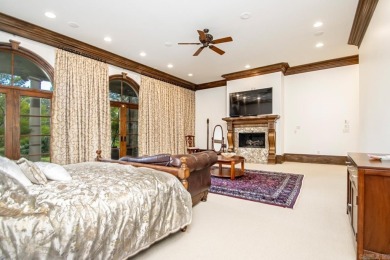 Tucked inside the gated Valley Falls Estates, this custom home