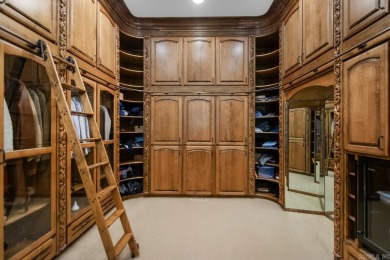 Tucked inside the gated Valley Falls Estates, this custom home