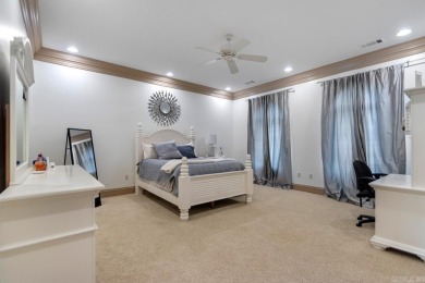 Tucked inside the gated Valley Falls Estates, this custom home