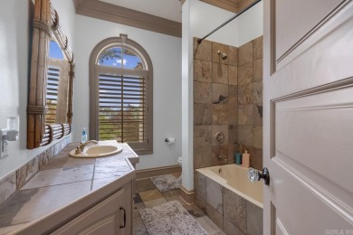 Tucked inside the gated Valley Falls Estates, this custom home