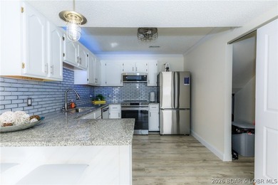 This stunningly remodeled lakefront home in Camdenton, Missouri - photo 30