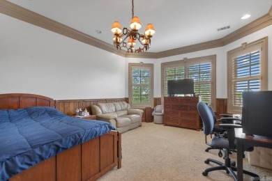 Tucked inside the gated Valley Falls Estates, this custom home