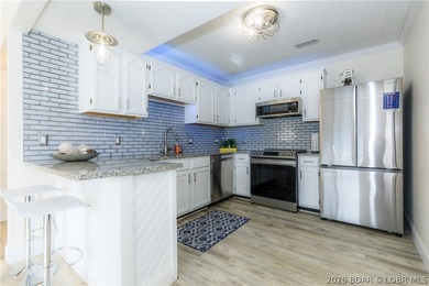 This stunningly remodeled lakefront home in Camdenton, Missouri - photo 31