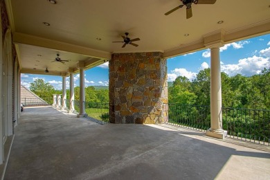 Tucked inside the gated Valley Falls Estates, this custom home