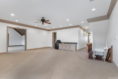 Tucked inside the gated Valley Falls Estates, this custom home