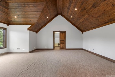 Tucked inside the gated Valley Falls Estates, this custom home