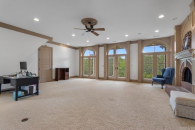 Tucked inside the gated Valley Falls Estates, this custom home