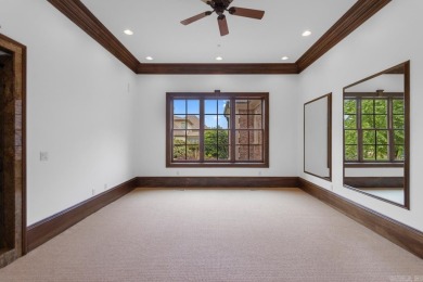 Tucked inside the gated Valley Falls Estates, this custom home