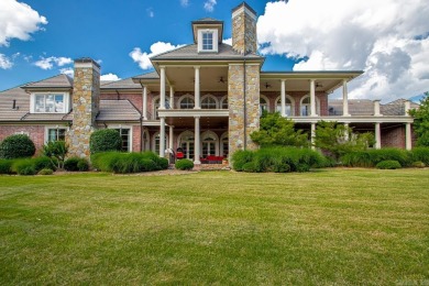 Tucked inside the gated Valley Falls Estates, this custom home