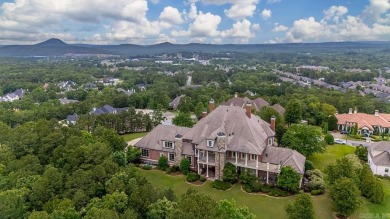 Tucked inside the gated Valley Falls Estates, this custom home