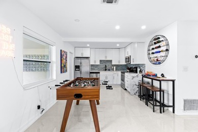 Welcome to this ultra-modern 3-bedroom, 2-bathroom single-story - photo 7