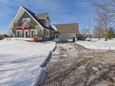 Nestled in the Lakes of the North HOA, this chalet offers the - photo 1