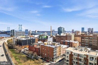 This beautifully updated penthouse offers a unique blend of - photo 1