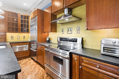 This beautifully updated penthouse offers a unique blend of - photo 4