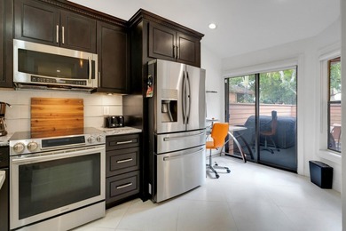 Welcome to this beautifully remodeled townhome, where style - photo 8