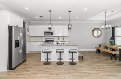 Take a look at this like-new, 3-bedroom, 2-bath home with an - photo 4