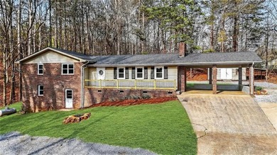 Welcome home to this beautifully renovated 1975 gem that - photo 2