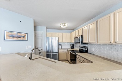 Experience Lake of the Ozarks living at its finest in this - photo 11