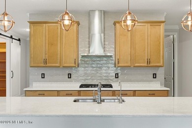 Welcome to this beautifully upgraded home in WaterSong at - photo 10