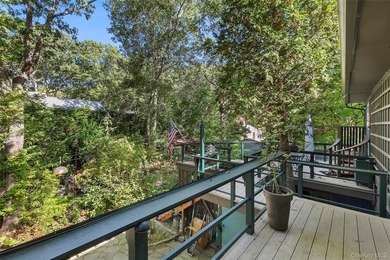 *A Peaceful Retreat Among the Trees.* Designed to embrace its - photo 16