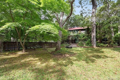 *A Peaceful Retreat Among the Trees.* Designed to embrace its - photo 20