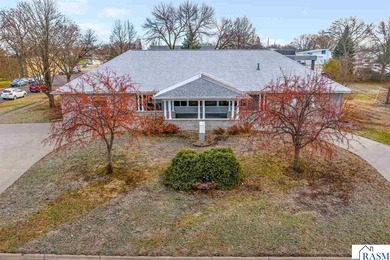 Centrally located on a corner lot in Blue Earth, this versatile