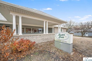 Centrally located on a corner lot in Blue Earth, this versatile