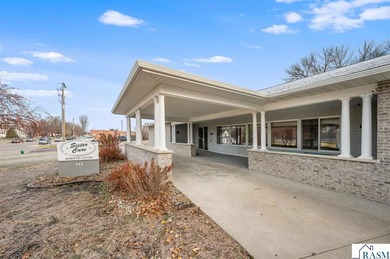 Centrally located on a corner lot in Blue Earth, this versatile