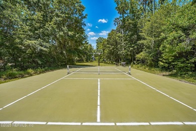Nestled on a private 1.67-acre estate across from the - photo 3