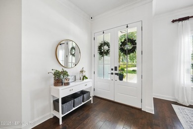 Nestled on a private 1.67-acre estate across from the - photo 7