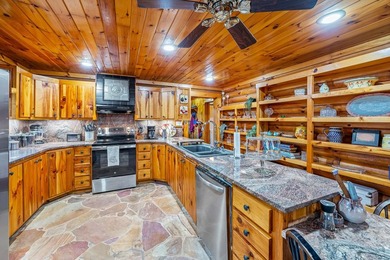 One-owner custom built log home on 2.5 acres on a small lake - photo 13