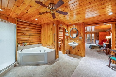 One-owner custom built log home on 2.5 acres on a small lake - photo 19