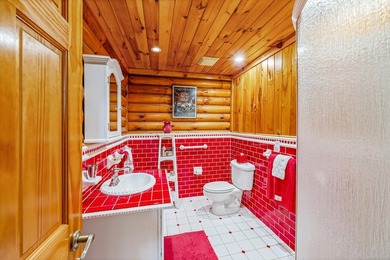 One-owner custom built log home on 2.5 acres on a small lake - photo 24