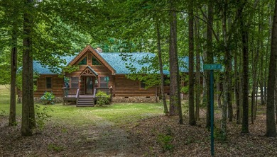 One-owner custom built log home on 2.5 acres on a small lake - photo 29