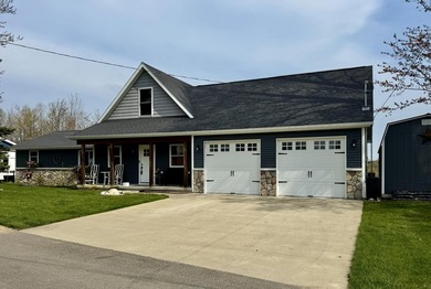 New canal-front listing on Houghton Lake offering 120 ft of - photo 1