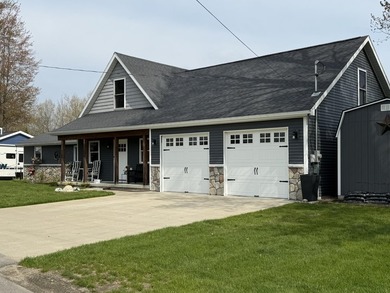New canal-front listing on Houghton Lake offering 120 ft of - photo 2