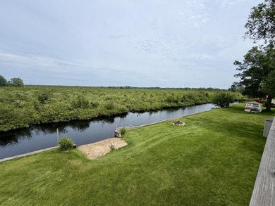 New canal-front listing on Houghton Lake offering 120 ft of - photo 5