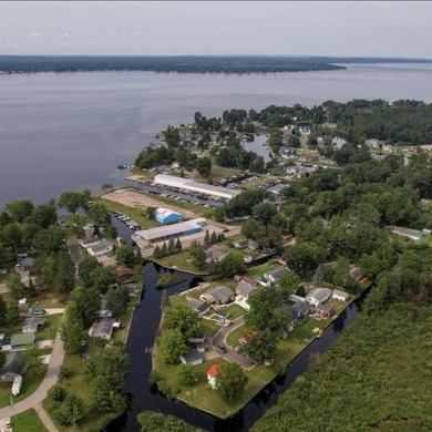 New canal-front listing on Houghton Lake offering 120 ft of - photo 7