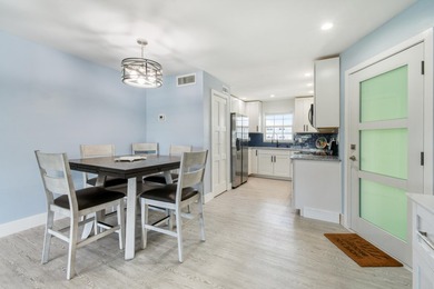 Experience waterfront living in this beautifully updated - photo 12