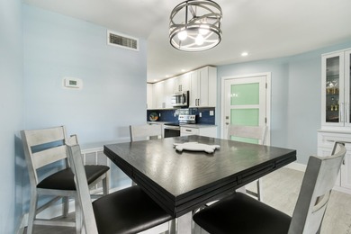 Experience waterfront living in this beautifully updated - photo 13